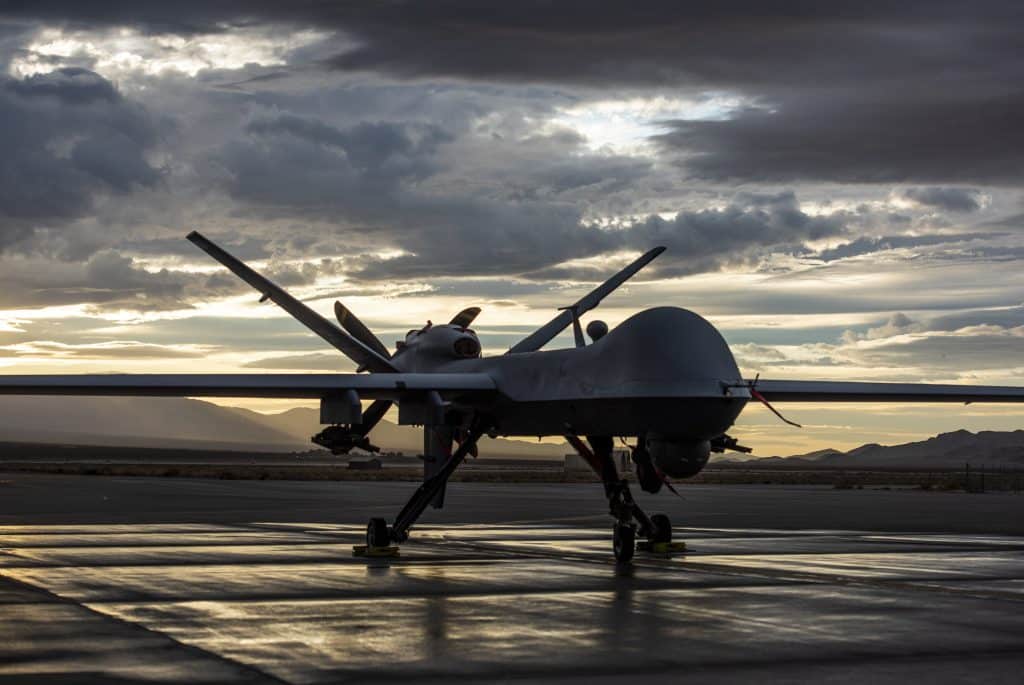 MQ-9 Reaper and aircrew underneath Nevada sunset