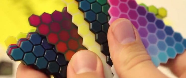 multicolor heptagon design shape holding in hands